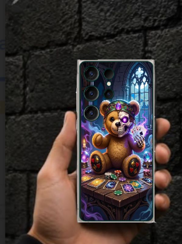 A hand holding a phone with a mystical teddy bear case.