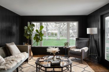 Hardwood acoustic vertical slat wall panel gallery. Shown in black finish.