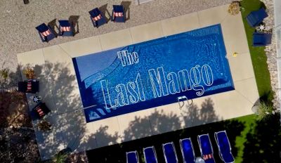 A swimming pool with "The Last Mango" text at the bottom.
