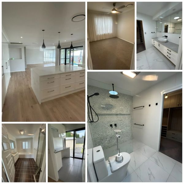 Modern home interior with kitchen, bathrooms, bedroom, and laundry area.