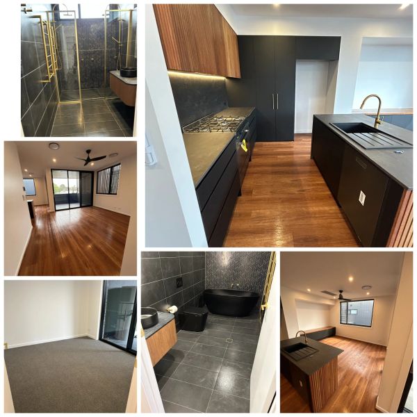 Modern apartment with sleek kitchen, wood floors, and stylish bathroom.