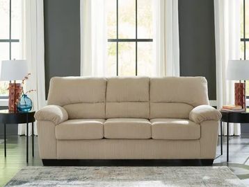 Beige three-seater sofa in a modern living room.