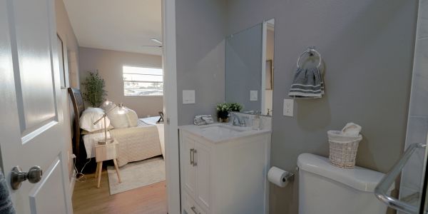 Small bathroom with a bedroom view.