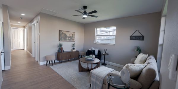 Modern living room with neutral tones and minimalist decor.