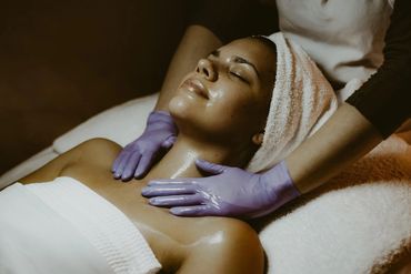 Woman enjoying a relaxing neck and shoulder massage at a spa.