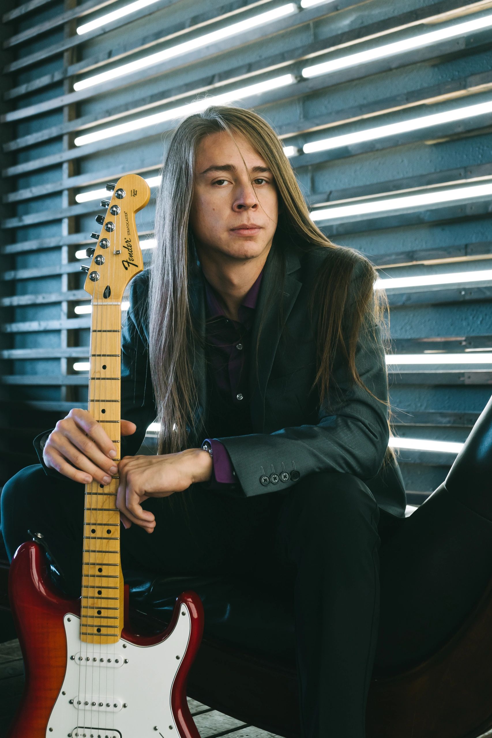 myself holding my guitar.