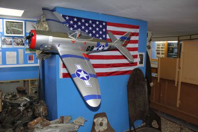 Model of P47 Fighter at Benzett Airfield Museum along with crash site relics and memorabilia.