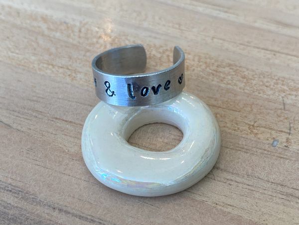 An encircled metal with design