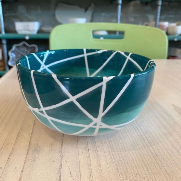 A dark blue ceramic with white stripes