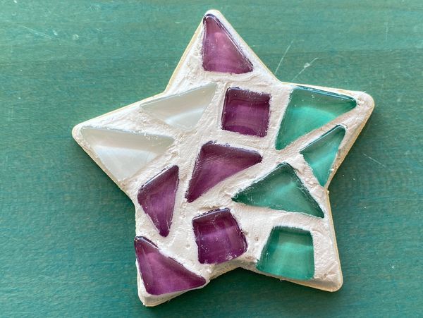 A star with three mosaic colors and filled in white material