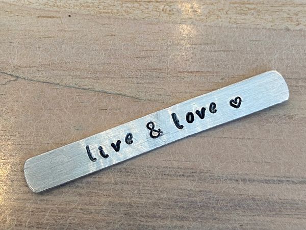 A metal with a stamped design