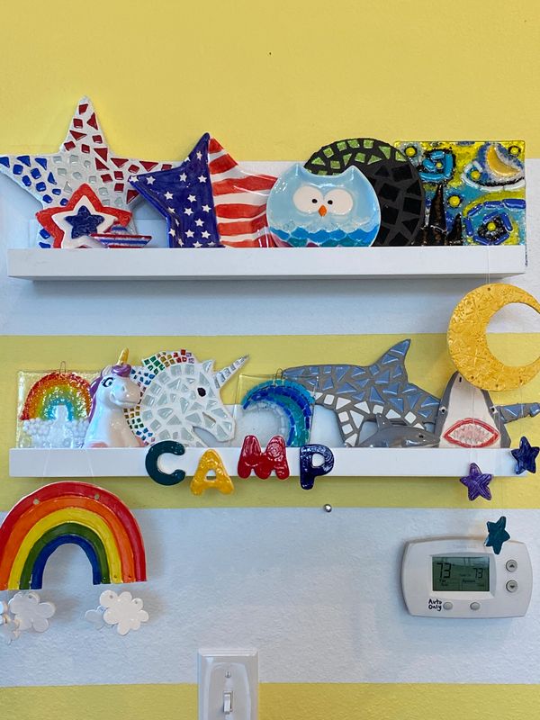 Shelves with painted ceramics