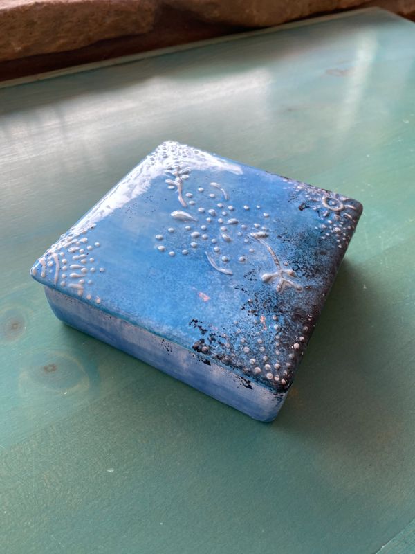 A painted square ceramic
