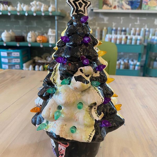A ceramic Christmas tree with colorful designs