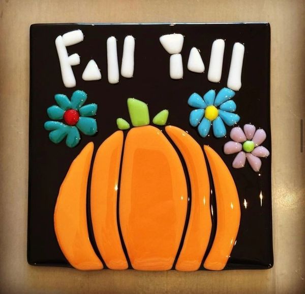 A painted pumpkin on a ceramic