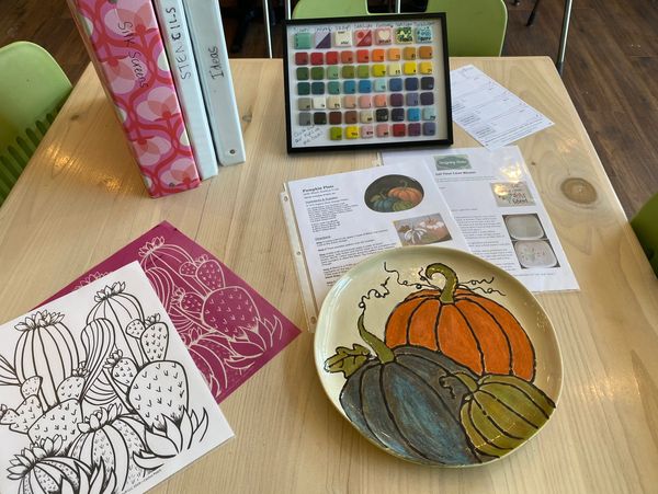 A finished painting on a ceramic plate