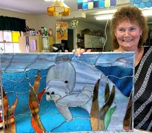 Carol and her Manatee stained glass. Carol takes lessons here and if you are interested contact me.