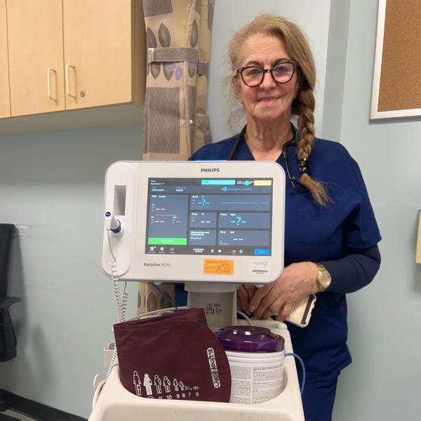 nurse holding blood pressure monitor