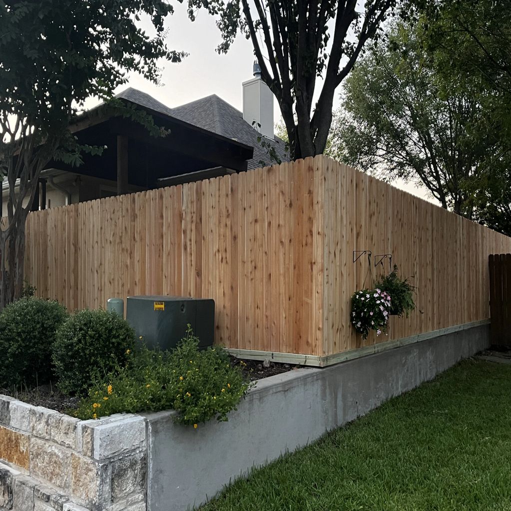 New wooden fence around a backyard.