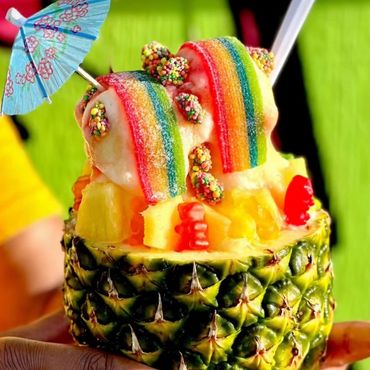 Our World famous Pineapple Water Ice topped with delicious sweet candy