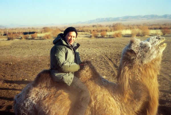 Riding a camel in Outer Mongolia.