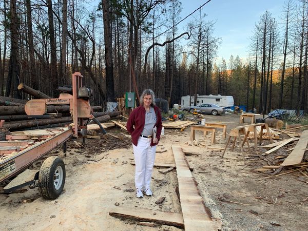 Bobbie Rae Jones stands in the middle of a construction site in the forest