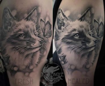 Realistic tattoo of a fox and butterfly in black and grey.