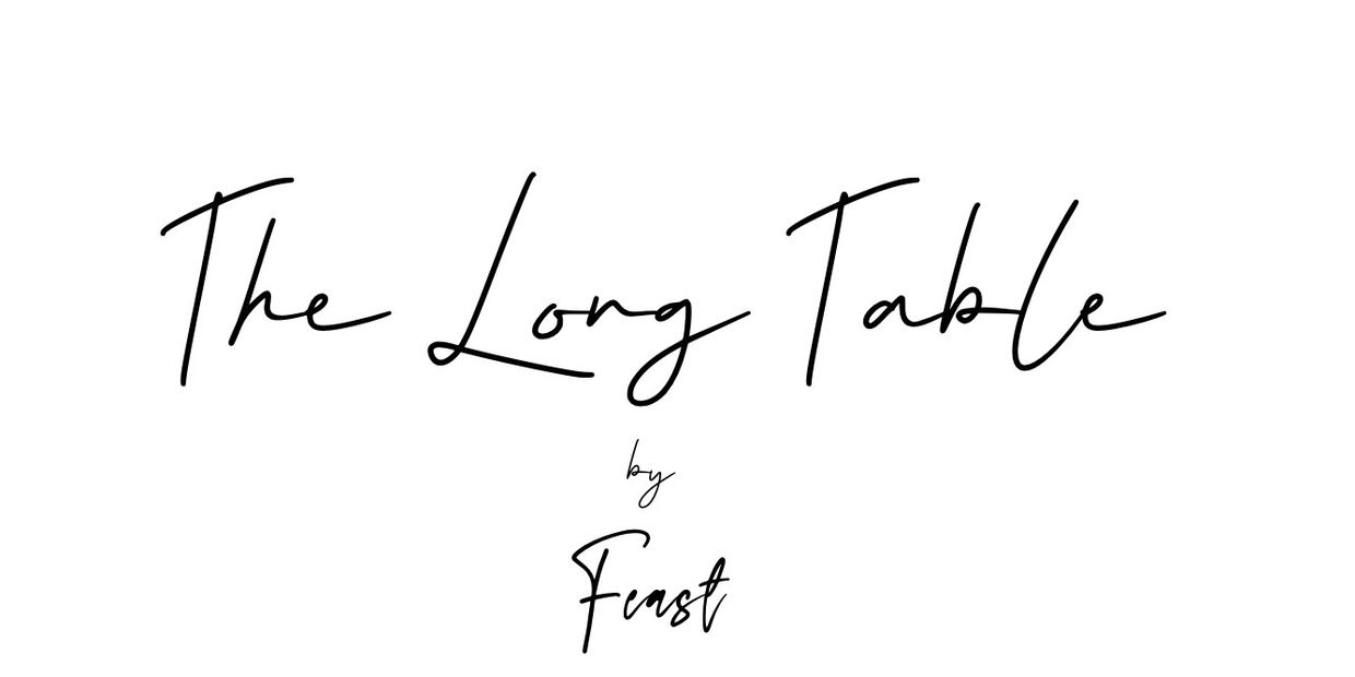 Handwritten text reading 'The Long Table by Feast' on a white background.