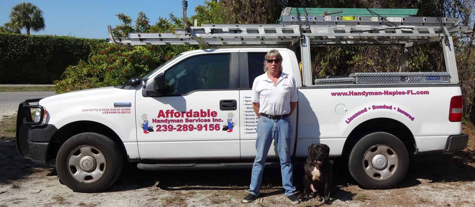 Home security (my dog) and me in front of the screen repair, hurricane shutter repair truck in Naple