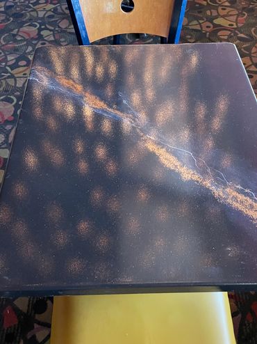 Joey's Italian Restaurant dining table reflecting lights.