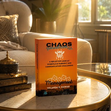 Book titled 'Chaos Management' by Yolanda D. Dawan on a sunlit marble table.