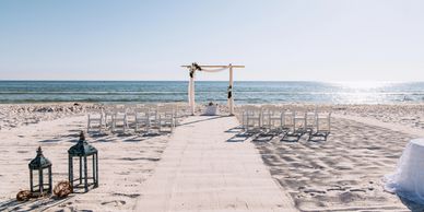 beach wedding ceremony set up on the beach