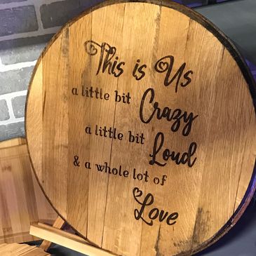 Bourbon barrel head laser engraved with a custom quote
