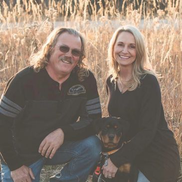 Mike and Michelle Kalmer, owners of kalmer & co. with their Rottweiler