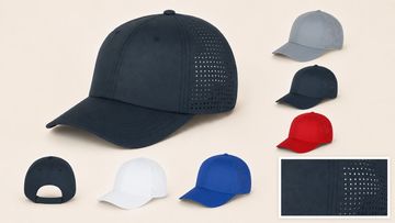 A collection of baseball caps in various colors with perforated side panels.