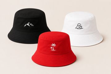 Three colorful bucket hats with nature-themed embroidery.