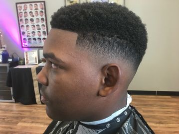 Fresh haircut with a clean fade and sharp line-up.