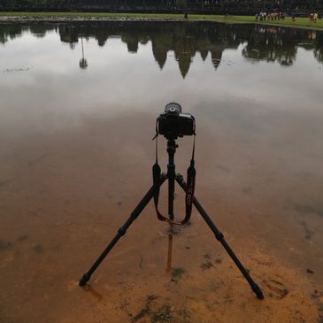 One of my Canon cameras taking a picture of sunrise at Angkor Wat in Cambodia
