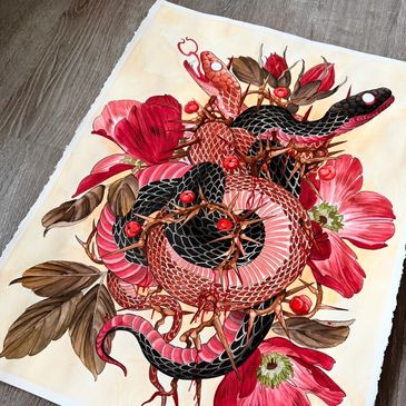 Artwork of intertwined red and black snakes with red flowers.
