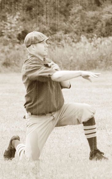 Brad "Woody" Zreny makes the throw from one knee.