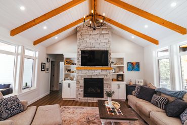 Fir beams with shiplap on vaulted ceiling
Stone fireplace
Home builder in Prince George