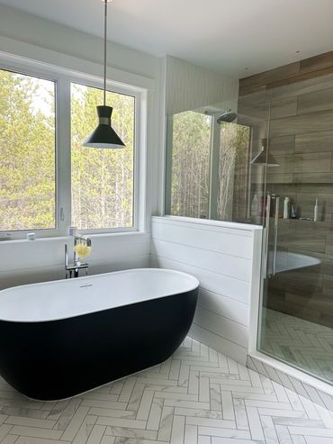 Home builder Prince George
Black soaker tub
Herrignbone floor tile
Wood look shower tile
Custom show