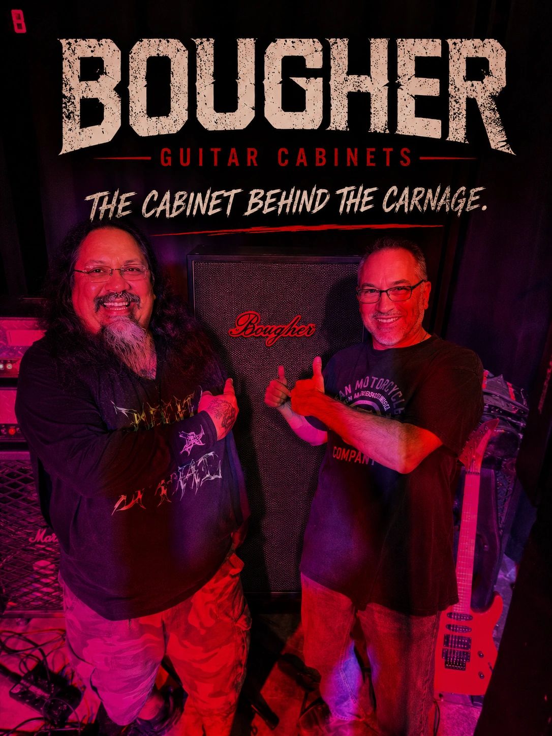 Two men posing happily in front of a Bougher guitar cabinet with a red lighting.