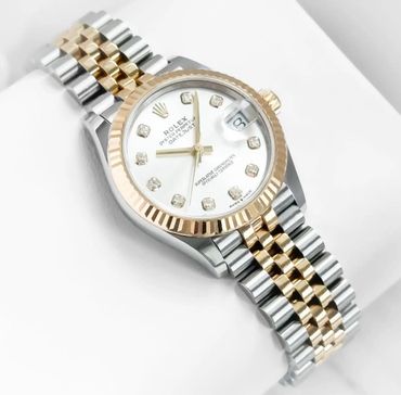 The quintessential Lady Datejust. 31mm two tone yellow gold silver diamond dial. 278273.
