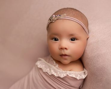 Awake newborn during her studio maternity session in chino hills with best newborn photographer.