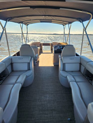 Interior pic of 2017 Harris tritoon. Pic of front of boat from rear of boat.