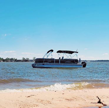 Port side image of 2017 Harris at Ayers Island. Montgomery Texas lake. Pic shown with half Bimini