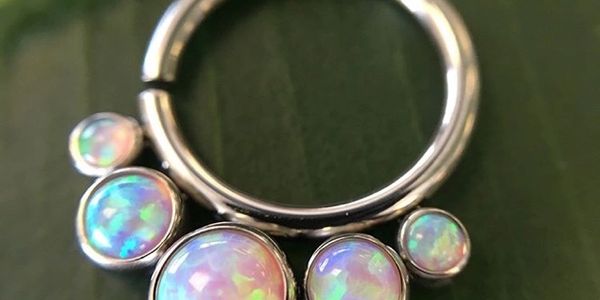 Dead RockStar Body Tattoos & Body Piercing:
Seamless ring with white opal beads attached polished titanium