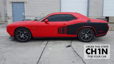 Matte black "HEMI" side graphics on a bright red Challenger.