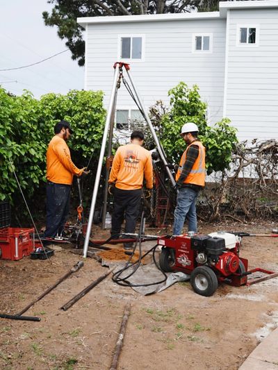 Our team collecting soil samples for a soils report.